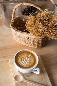 High angle view of cappuccino on wooden table