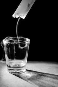 Close-up of wine glasses on table