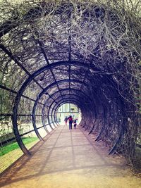 Woman walking in tunnel