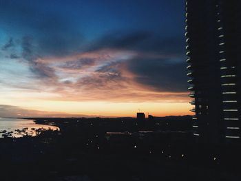 Silhouette of city at sunset