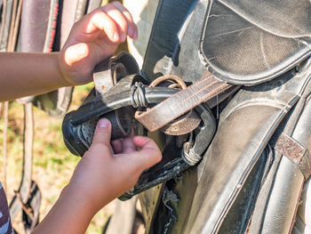 Close-up of man working on metal