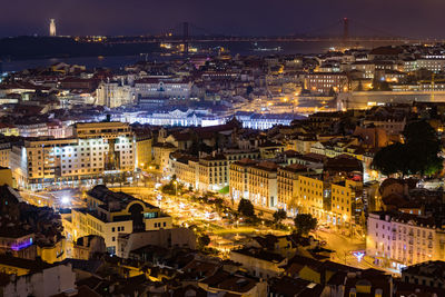 High angle view of illuminated buildings in city at night