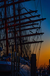 Sunset through the masts of a tall ship