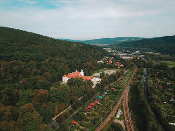 High angle view of trees and buildings in city