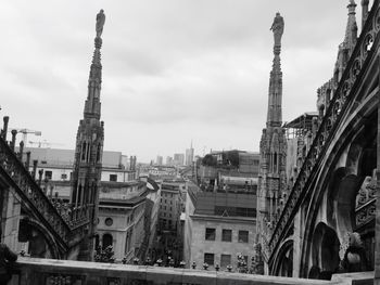 Buildings in city against sky