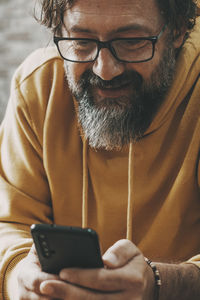 Close-up of man using mobile phone