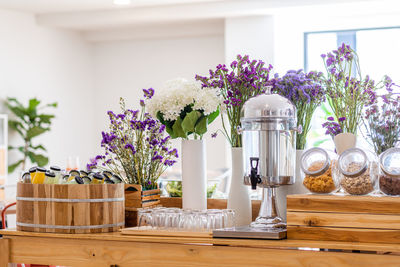 Flower vase on table at home