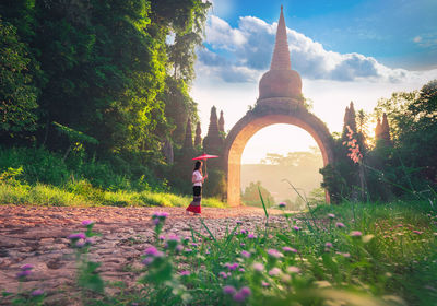 Person in temple against sky