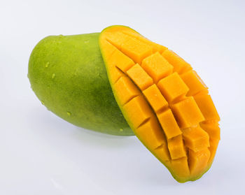 Close-up of lemon slice against white background