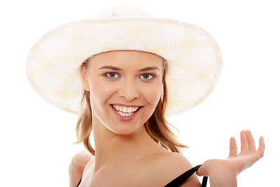 Portrait of a smiling young woman against white background