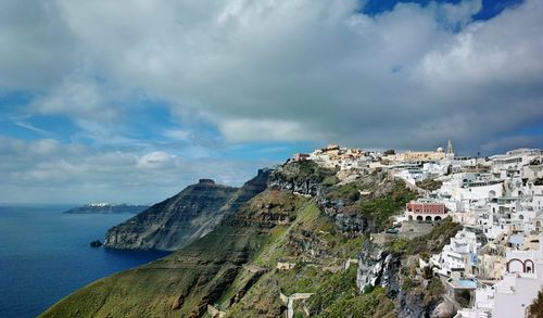 Panoramic view of townscape by sea against sky