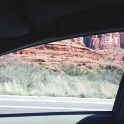 Road seen through car window