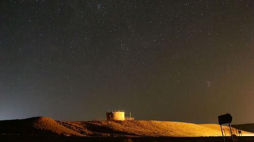 Low angle view of building against sky at night