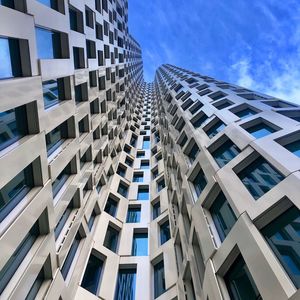 Low angle view of modern buildings against sky