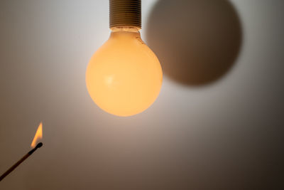 Close-up of illuminated light bulb