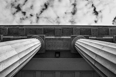 Low angle view of building against cloudy sky