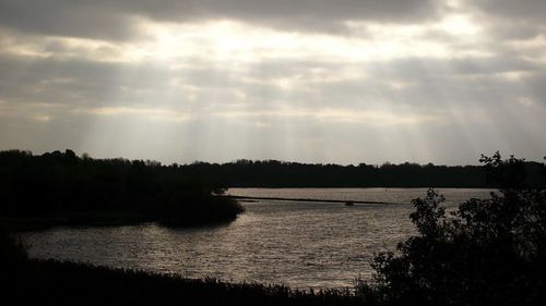 Scenic view of cloudy sky over river