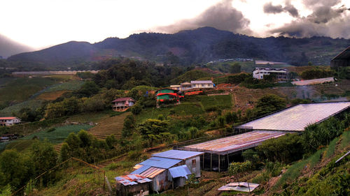 High angle view of houses and buildings against sky