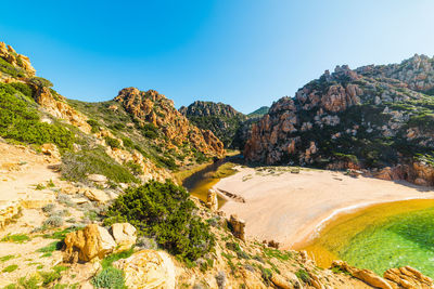 Scenic view of mountains against clear blue sky