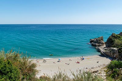 Scenic view of sea against clear blue sky