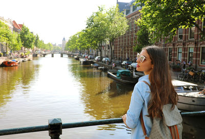 Young woman in boat on canal