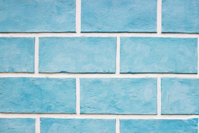 Textures on the blue wall, blue brick wall background.