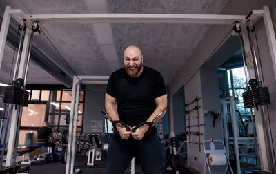 Portrait of man standing in corridor