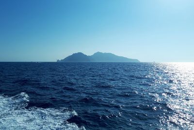 Scenic view of sea against clear blue sky