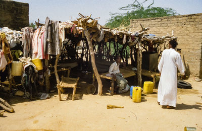 People working at market stall