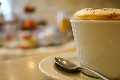 Close-up of coffee cup on table