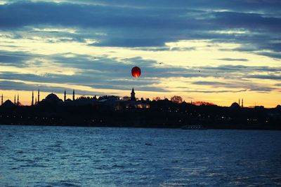 Scenic view of river against sky during sunset