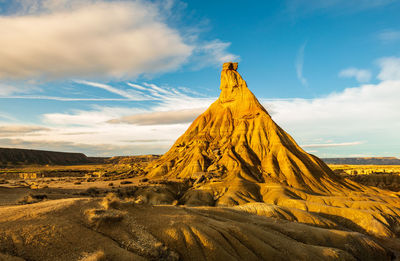 Scenic view of rock formation at desert against sky