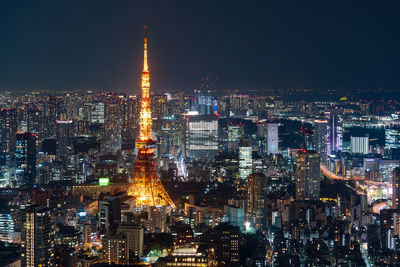 Illuminated buildings in city at night