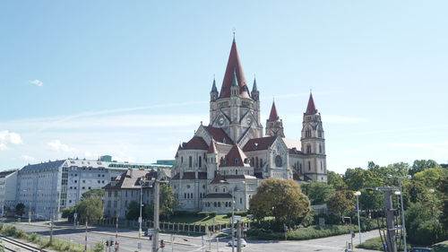 Buildings in city against sky