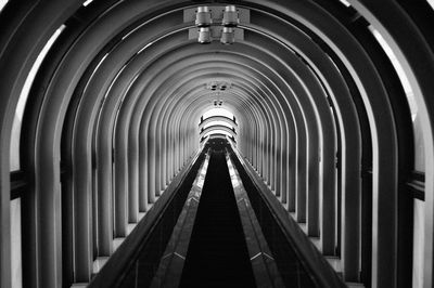 Low angle view of illuminated tunnel