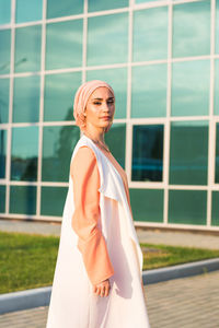 Portrait of woman standing outdoors