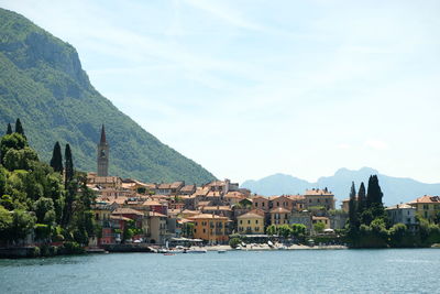 Scenic view of sea and mountains against sky