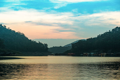 Scenic view of lake against sky during sunset