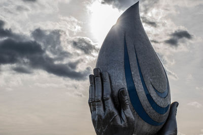 Low angle view of statue against sky