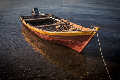 Fishing boat moored at sea shore