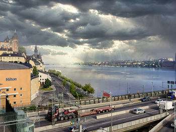 High angle view of road by city against sky