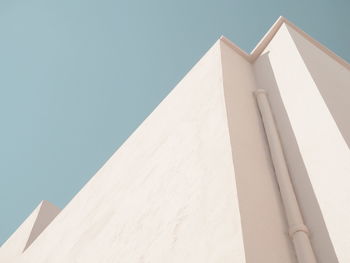 Low angle view of building against clear blue sky