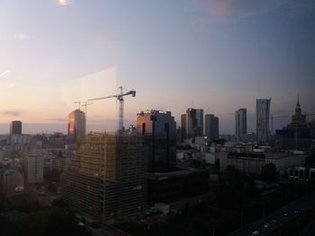 High angle view of buildings in city against sky during sunset