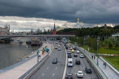 High angle view of traffic on road against cloudy sky