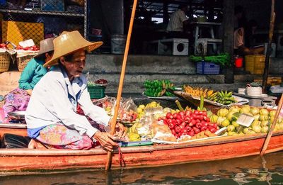 Man preparing food at market stall