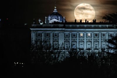 Reflection of building in city at night