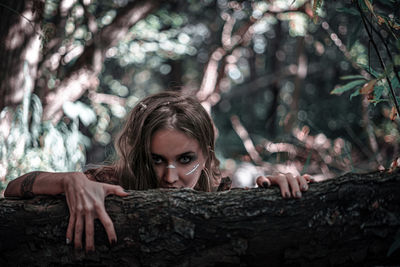 Portrait of woman in forest