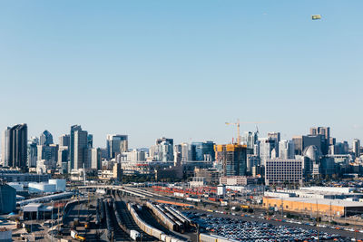 High angle view of cityscape against blue sky