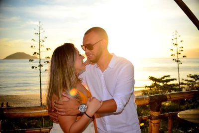 Couple against sky during sunset