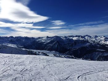 Scenic view of snowcapped mountains against sky